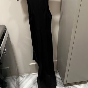 Alexis shin length fitted black dress, very slimming…bottom of dress is cascade